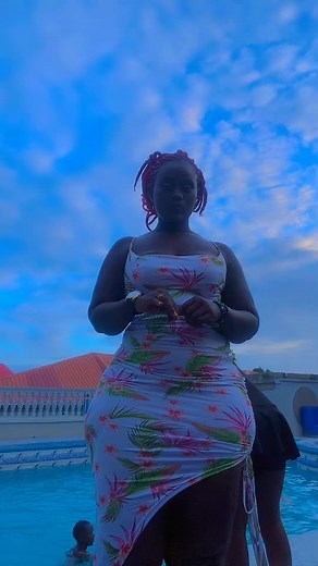 Elegant Poolside Fashion: A Woman in Floral Dress