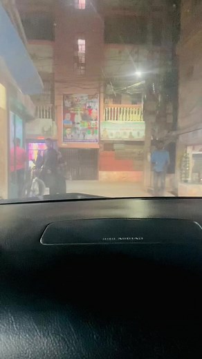 Urban Night Walk: A Glimpse from a Vehicle