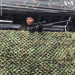 Protesters set up a mock military checkpoint near the border between Ireland and Northern Ireland on Saturday, Jan. 26. The demonstration was against military action that could happen as a result of Britain leaving the European Union. Irish Prime Minister Leo Varadkar said soldiers might have to return to the border if the Brexit went wrong. Ireland said it would be difficult to avoid imposing a border if Britain leaves the EU. (REUTERS) | Voice of America