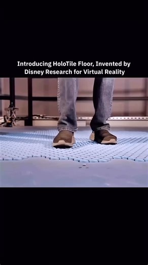Knowledge Universe on Instagram: "Disney revealed the HoloTile, a smart floor designed for virtual reality. The system allows people to walk naturally in any direction while staying in the same physical space. As a person moves, the floor shifts beneath their feet to counter each step. Each tile responds in real time using sensors and motion control. When a step moves forward, the surface slides backward. This keeps the user centered while creating the feeling of continuous movement. The body ex