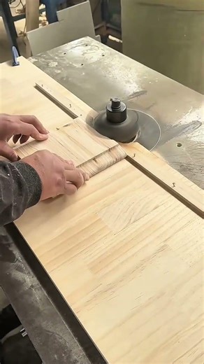 shaping wood pieces using a specialized milling machine to create smooth curved edges and patterns
