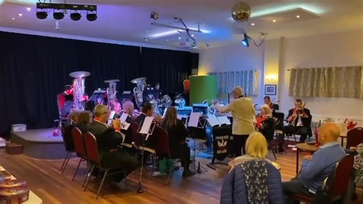 The band playing 'Jingle Bell Swing' at the Lambourn Christmas Concert. | Phoenix Brass Band