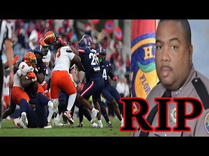 Police Officer DEAD after taking MASSIVE SIDELINE HIT by College Football player during game!