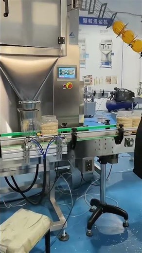 Four-head vertical powder filling and capping machine | 25-35 cans/minute.
