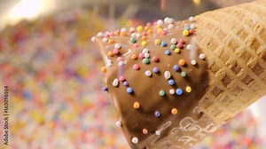 Woman Coats Hand Dipped Chocolate Sugar Cone With Colorful Sprinkles Stock Video