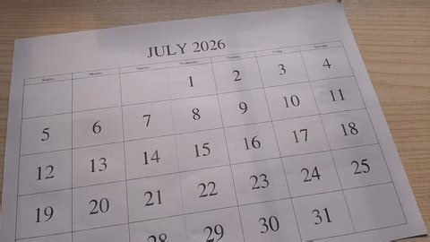 clip-3994360601-marking-july-2026-date-on-calendar
