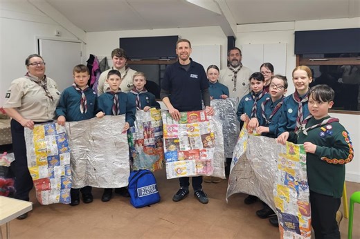 Eco-friendly Kettering Scout Group present crisp packet space blankets to Street Pastors