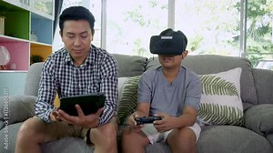 Happy Asian family spend times for relaxing together at home