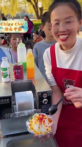 Colorful shaved #ice, a nostalgic #childhood memory for so many! Who else remembers the joy of indulging in a rainbow of flavors on a hot #summer day? Let's share those sweet moments of innocence and delight! | Beijing Review