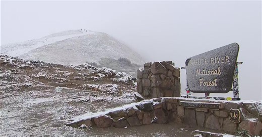 On top of Loveland Pass in Colorado, hikers run into snowy scene