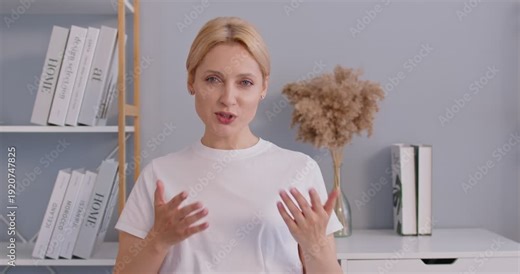 Beautiful happy woman speaking to camera for video call, online presentation recording on webcam, talking and gesturing, beauty blogger lady creates video content, tutorial, beauty care review