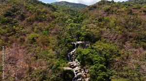 Spectacular Waterfall Oasis Brings Life, Beauty, And Vibrant Energy To The Semi Desert Jungle Mountains Of Nui Chua, Vinh Hy Bay, Vietnam. Slow Aerial (Zoom In) Over The Top Of The Falls.