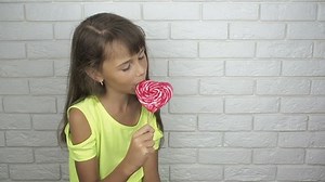 Little girl with a lollipop.