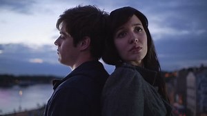 Couple having relationship difficulties, standing back to back.