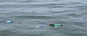 Ocean Pollution: Plastic Waste Floating on Water Surface, Environmental Damage