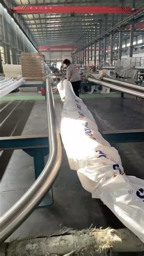 The final step in manufacturing stainless steel light pole: applying the outer packaging.