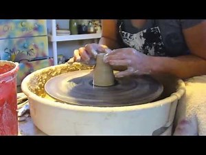 Throwing cat salt and pepper shakers on the potters wheel