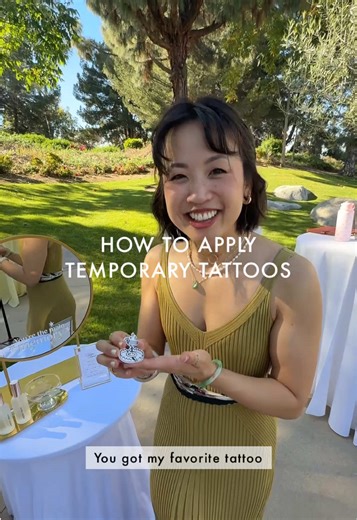 Peel plastic → tattoo face down → add water 💧 → wait ⏳ → peel → instant ink ✨ Easy. Unless you’re three cocktails deep 🍸🍸🍸 and forget to remove the plastic film first… which did in fact happen at one wedding and I briefly thought the tattoos were defective. 😭 Laura kindly volunteered as tribute for today’s demonstration 🫡 ✨ The Keepsake Kiosk is an interactive wedding activation where guests dispense collectible stickers and temporary tattoos from a vending machine. #temporarytattoo #weddi