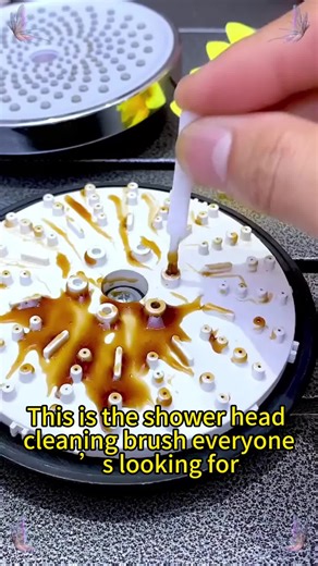 This tiny brush cleans shower heads AND keyboard keys—total game changer! 🧹#fyp #TikTokMakeMeBuyIt #multipurposecleaner #bathroomessentials #cleaningmusthave