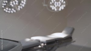 Blurred shot of an empty modern operating room at the hospital in the daytime with the lights turned on. Operating theatre, details close up. Using modern technologies and newest equipment in medicine