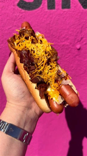 Love is in the air… and in the bun. 💘🌭 Introducing our Valentine’s Day Hot Dog — two hot dogs in one bun, topped with bacon, grilled onions, mayo, ketchup, and a cheddar cheese sprinkle. Available this weekend for $9.14 💕