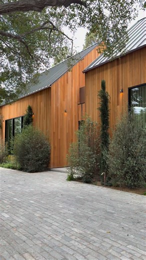 Piller+ on Instagram: "Hidden within the hills of Fryman Canyon, this private estate feels shaped by the land as much as designed. A series of sculptural forms rise quietly from the landscape, wrapped in warm cedar and framed by century old trees and rolling terrain. The architecture balances presence with restraint. Soaring volumes open into more intimate spaces, where natural materials, soft light, and thoughtful proportions create a sense of warmth throughout. Every element feels intentional,