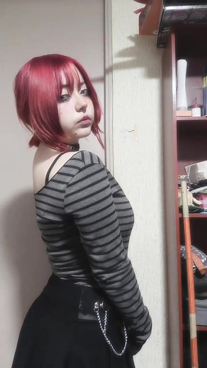 Cosplayer with Red Hair: A Stunning Expression