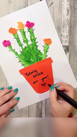Spread a little love with this adorable cactus handprint craft! 🌵 💕 This is a really fun craft to make for friends or family this Valentine’s Day! You will need: A sheet of paper, Green paint, tissue paper, red paper and a black marker. Glue and scissors to put together! #crafting #craftideas #craft #valentinesday #crafts | Home is Where the Art is