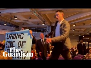 'Barclays funds climate chaos': bank's AGM disrupted by climate protesters
