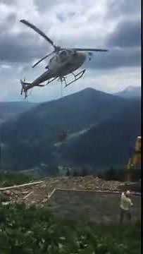 Amazing helicopter concrete delivery by helicopter up a mountain construction building project
