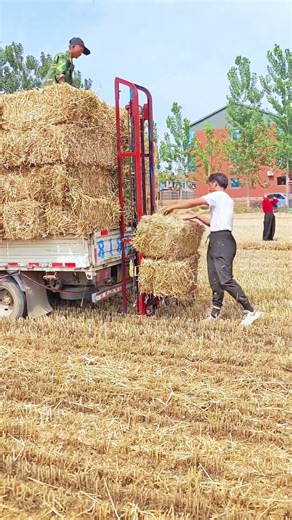 Farm Hack: Using a Bale Elevator to Load Hay onto a Truck
