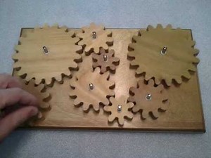 Wooden gear system (puzzle/toy)