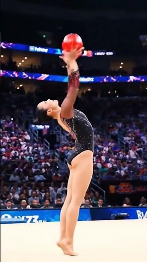 Rhythmic Gymnast Shines With Red Ball Routine on Championship Stage