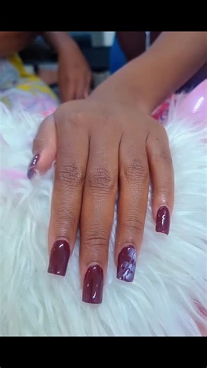 Makeup artist on Instagram: "Burgundy elegance with a touch of art 💅🏽✨ One finger, one statement because details matter. Simple, bold, and beautifully done. #BurgundyNails #NailArtDesign #StatementNails #ClassyNails #LuxuryNails NailInspo NailsOfInstagram ProfessionalNails SalonLife BeautyInDetails NailGoals"