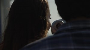 Slow motion of young couple using telescope close up