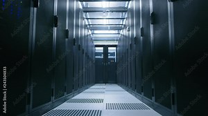 Data Center With Between Two Rows of Fully Operational Server Racks. Concept of Telecommunications, Cloud Computing, Artificial Intelligence, Database, Supercomputer Technology. Moving Through Shot