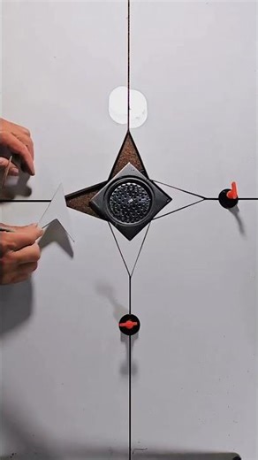 Installation of star patterned tiles for decorative floor finish