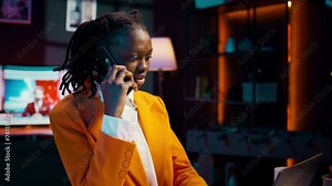 Student calling her professor to discuss about class materials, organizing study schedules and timelines based on online lessons. African american girl talking on smartphone call. Camera B.
