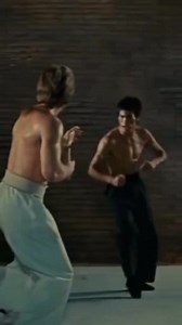 🎬 Reel Caption (English): 🐉🔥 Bruce Lee vs Chuck Norris — The Ultimate Showdown! In this legendary 17-second moment from Way of the Dragon, Bruce Lee unleashes his unmatched speed and precision against Chuck Norris in the Colosseum of Rome. Every movement, every strike, and every stare shows what true martial arts mastery looks like. This isn’t just a fight — it’s history in motion. ⚔️ Two warriors. One legend. 💥 The intensity, the respect, the technique — this is why Bruce Lee remains the Ki