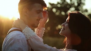 loving couple kissing at sunset