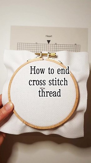 How to end your cross stitch thread. You can either slide your needle under the back of the cross stitches OR make a double knot at the back of your work . #crossstitching #crossstitchersontiktok #crossstitchtutorial #crossstitchlover #crossstitch #crossstitchoftiktok