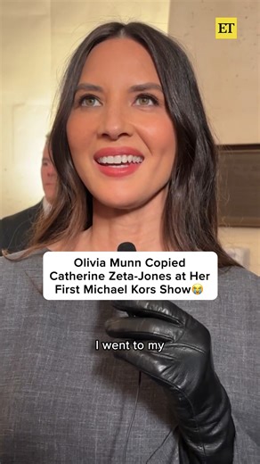 Olivia Munn made it through her first Michael Kors fashion show with help from the one and only, Catherine Zeta-Jones. 🖤 | Entertainment Tonight
