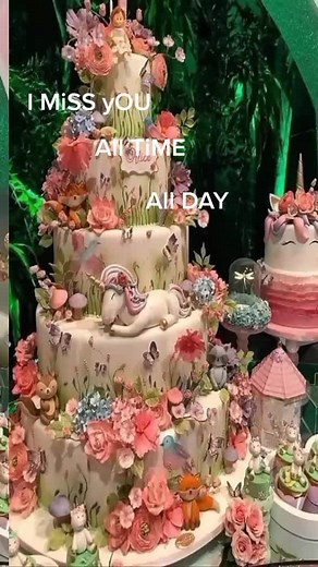 Elegant Multi-Tiered Cake with Whimsical Decorations