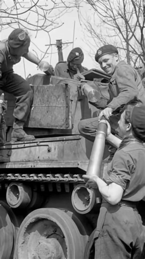 The crew of an A34 Comet tank from the 11th Armoured Division load 77 mm HV gun ammunition into their vehicle on April 13, 1945. As the war in Europe neared its end, crews worked quickly to keep their tanks combat-ready. The Comet—fast, well-armored, and powerfully armed—represented the peak of British cruiser tank development, and scenes like this capture the relentless tempo of operations during the final advance into Germany. | Survival Life Shop