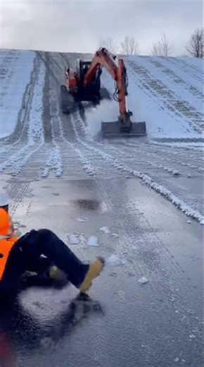 Excavator Slides Down Icy Hill Out of Control
