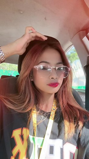 Long Reddish-Brown Hair Tips in Bright Car Setting