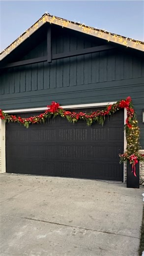 DIY Home Renovation, Interior Design & Budget-Friendly Projects on Instagram: "Every year I swag Greenery across our garage and it instantly makes the whole front of our house feel festive. I buy two 30' fresh cedar garlands from Costco each year, and then add in these special touches. Comment FESTIVE and I will send you the rest of the links to create this or check for links in my bio. If you're worried about the swag hitting your vehicles, just raise the garland or reduce the swag it still loo