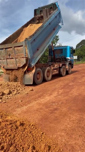 Heavy Machinery at Work: Dump Truck Offloading Soil