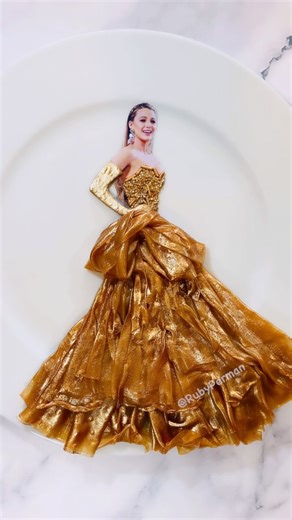 29K views · 85 reactions | ✨Blake is known for her Met Gala gowns! I recreated her look with 2 layers of rice paper, one dipped in aqua spirulina and one draped in edible glitter powder. I sprinkled bronze sugar to match the Art Deco–inspired metallic beading of her Atelier Versace gown. Excited to see what she wears tomorrow! @blakelively @metmuseum @metcostumeinstitute #metgala #blakelively #fashionicon | Ruby Perman Art | Facebook