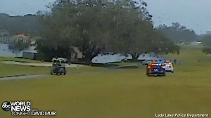 GOLF COURSE PURSUIT: Police dash camera video shows the harrowing moments when a suspect driving a stolen Community Watch SUV led police on a high-speed chase through an occupied golf course in Lady Lake, Florida Sunday morning, eventually crashing the vehicle into a building before being taken into custody by police. https://abcn.ws/2zD0xzI | ABC World News Tonight with David Muir